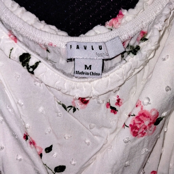 White Romper Dress with ruffle skirt, self tie straps, and floral embroidery. - Picture 6 of 6